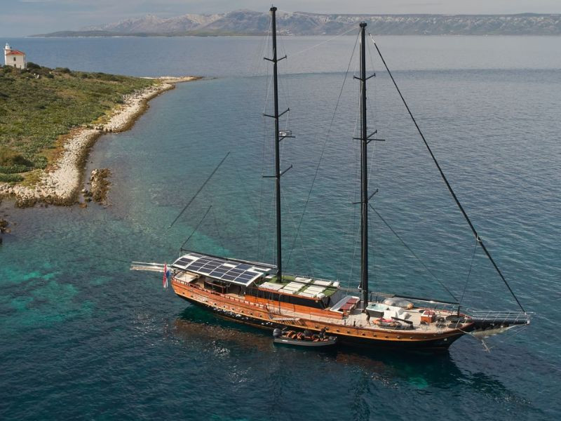 Stella Maris anchored beside a small island